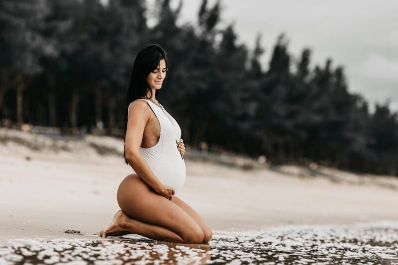 Pregnant Woman Practicing Prenatal Yoga on Beach at Sunset Stock Image -  Image of asana, lifestyle: 231568055