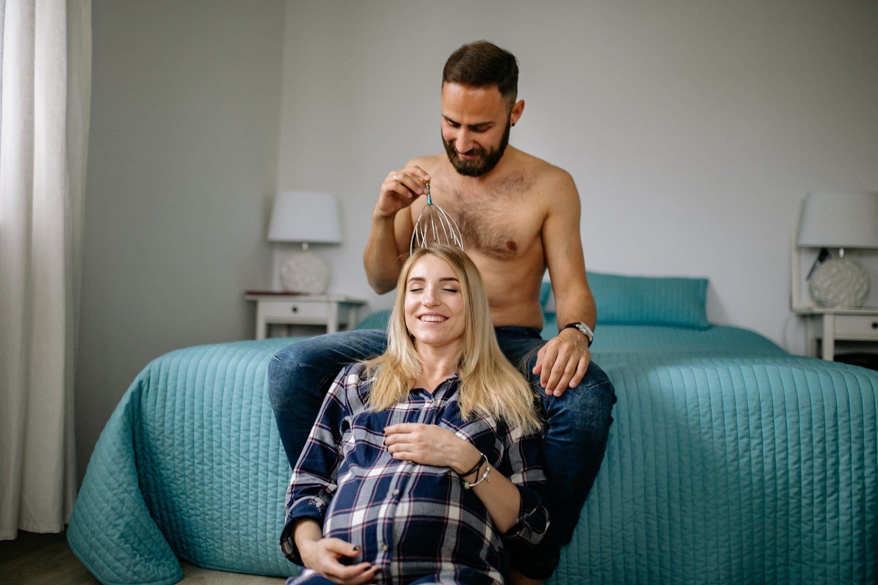 pregnant women receiving scalp massage